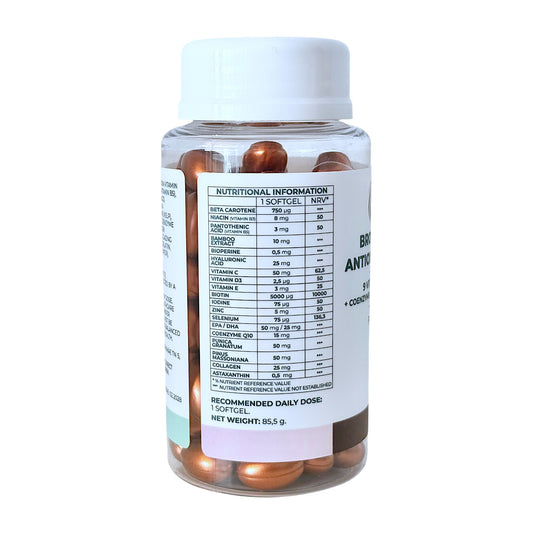 A jar of VITALITA Bronze & Beauty Antioxidant Formula with softgels inside. The label on the bottle indicates that it contains 9 vitamins and minerals - table side