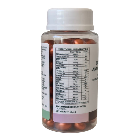 A jar of VITALITA Bronze & Beauty Antioxidant Formula with softgels inside. The label on the bottle indicates that it contains 9 vitamins and minerals - table side